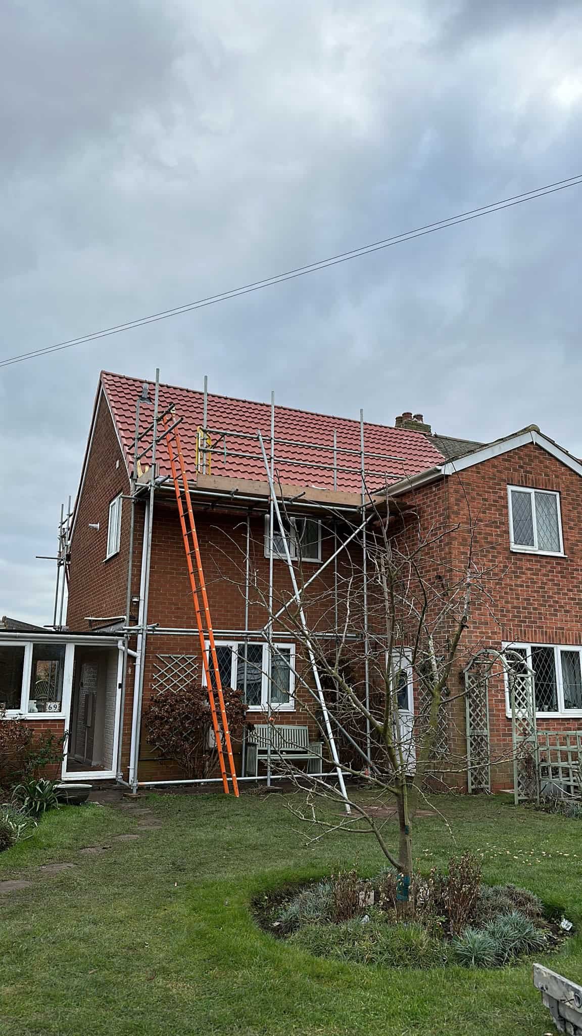 GWR Roofing Ltd roofer working on a pitched slate roof on a period property in Salisbury